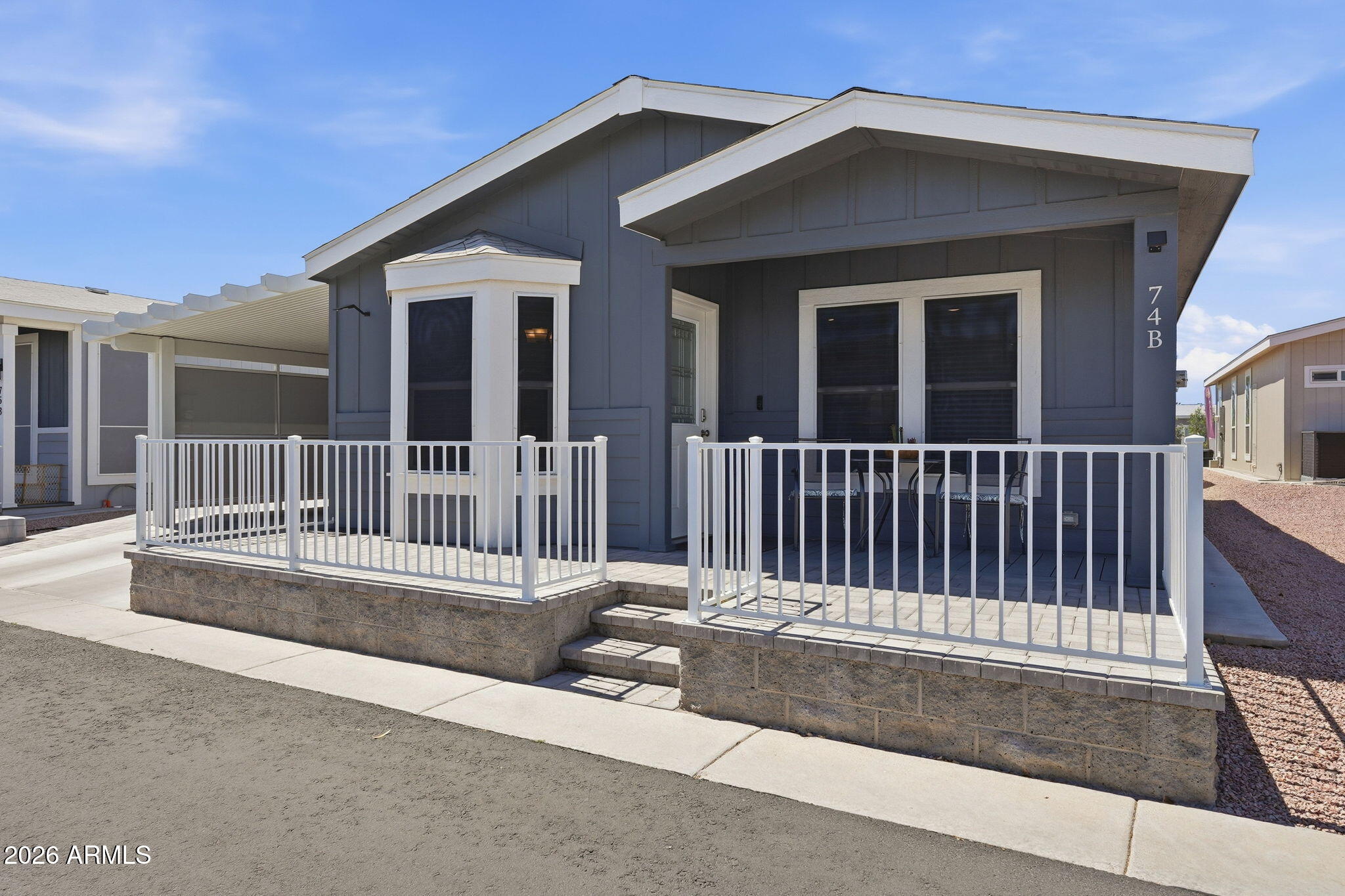 8865 East Baseline Road, Unit 74B Mesa, AZ 85209 - Photo 35 of 55 a view of a house with porch
