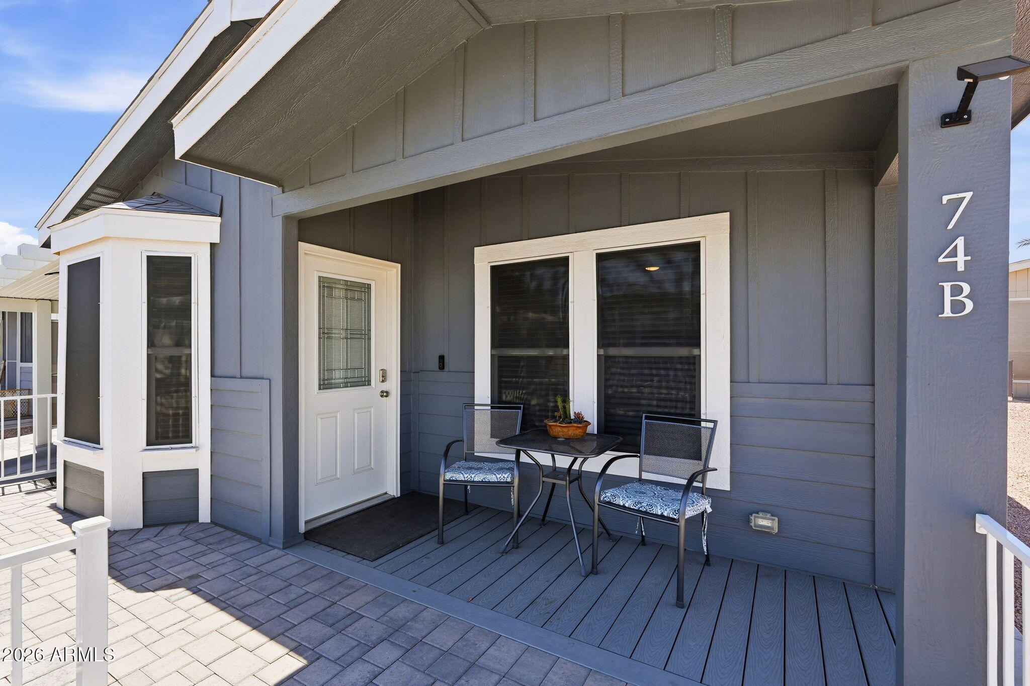 8865 East Baseline Road, Unit 74B Mesa, AZ 85209 - Photo 5 of 55 a view of a house with porch and wooden floor