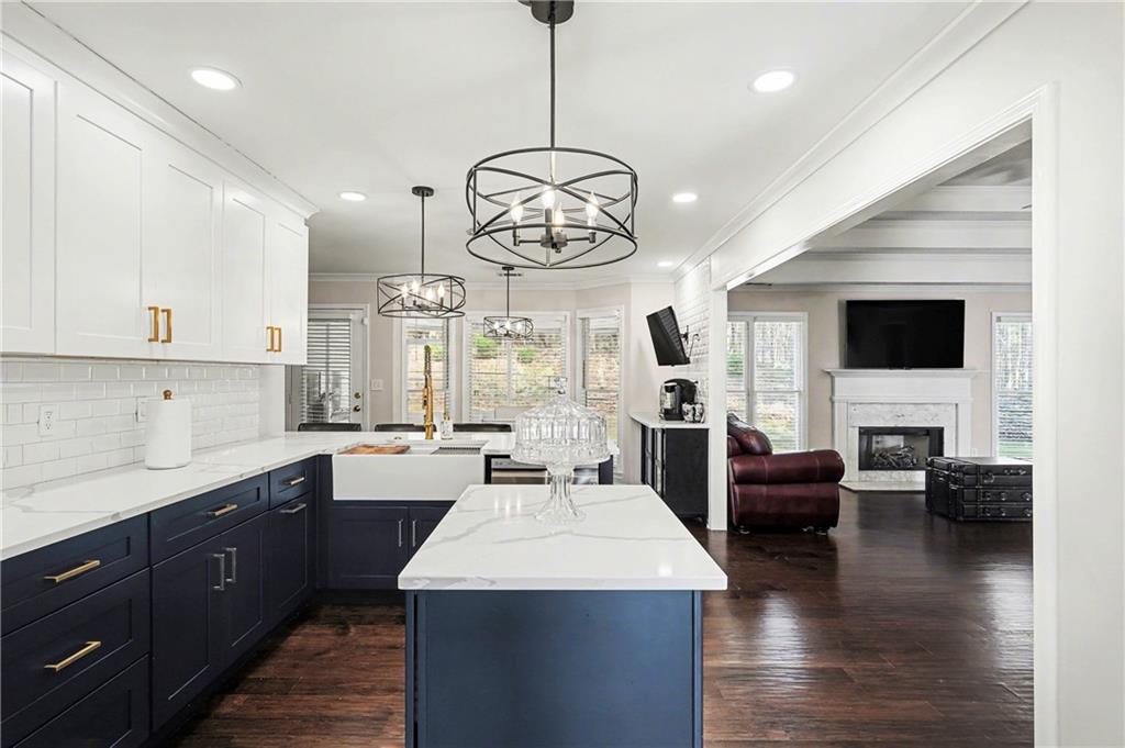 570 Morgan Court Hampton, GA 30228 - Photo 12 of 31 a large white kitchen with a large window and stainless steel appliances