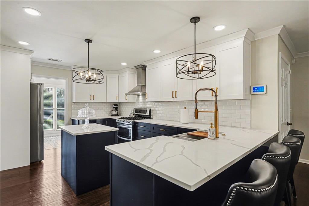 570 Morgan Court Hampton, GA 30228 - Photo 14 of 31 a kitchen with a table and chairs in it