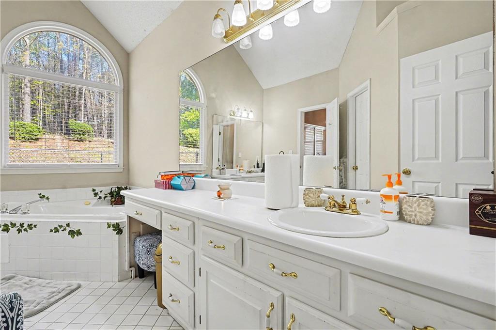 570 Morgan Court Hampton, GA 30228 - Photo 18 of 31 a bathroom with a double vanity sink and a window