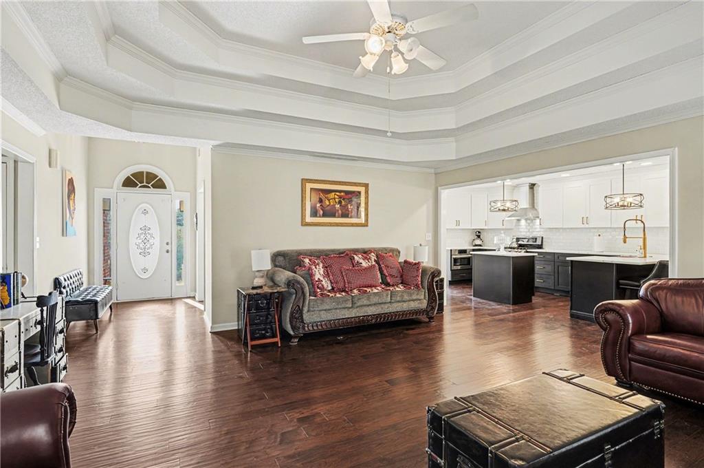 570 Morgan Court Hampton, GA 30228 - Photo 6 of 31 a living room with fireplace furniture and a wooden floor