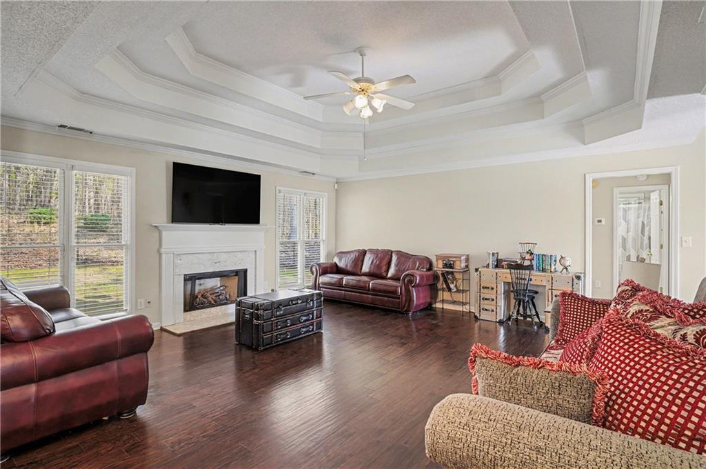 570 Morgan Court Hampton, GA 30228 - Photo 7 of 31 a living room with furniture or fireplace and a flat screen tv