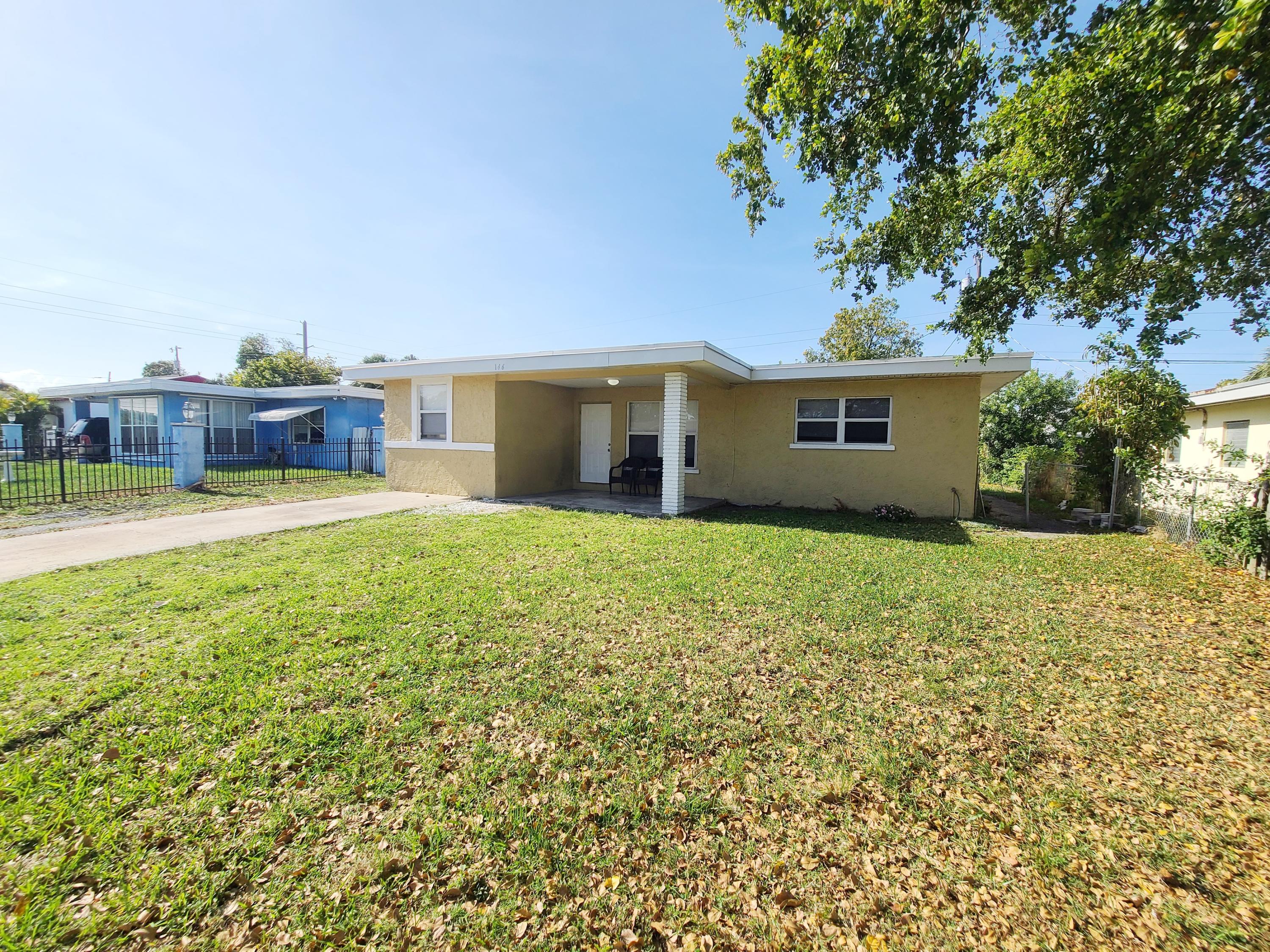 146 West 17th Street Riviera Beach, FL 33404 - Photo 1 of 18 Front Entrance