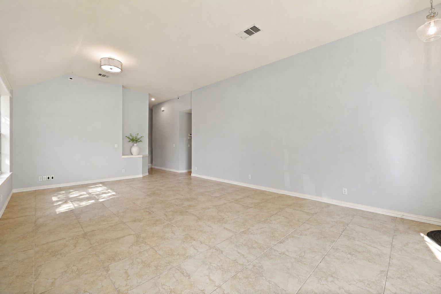 1102 Nelson Ranch Road Cedar Park, TX 78613 - Photo 7 of 37 Natural light cascades across the durable tile flooring of this spacious, adaptable living area.