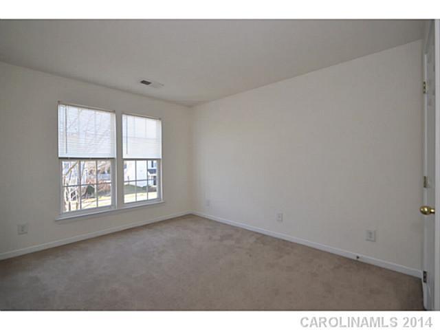 5028 Prosperity Ridge Road, Unit 5028 Charlotte, NC 28269 - Photo 12 of 16 a view of an empty room with a window