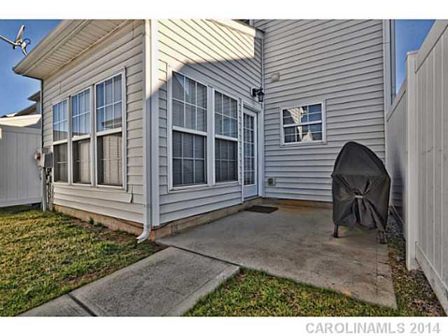 5028 Prosperity Ridge Road, Unit 5028 Charlotte, NC 28269 - Photo 15 of 16 a backyard of a house