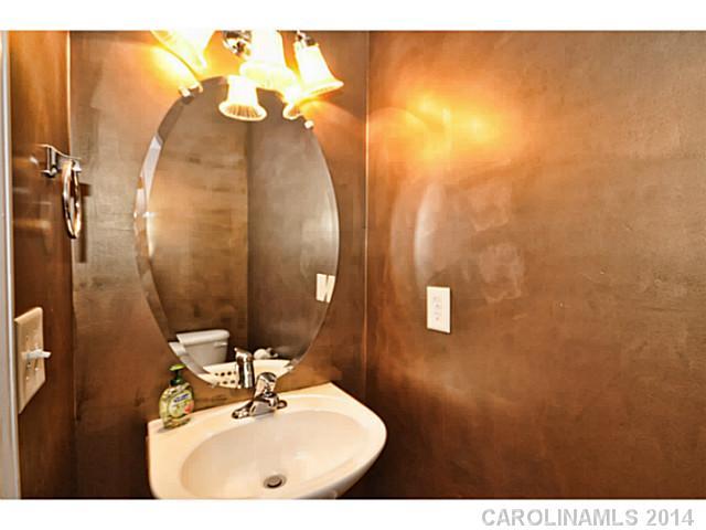 5028 Prosperity Ridge Road, Unit 5028 Charlotte, NC 28269 - Photo 9 of 16 a bathroom with a sink and mirror