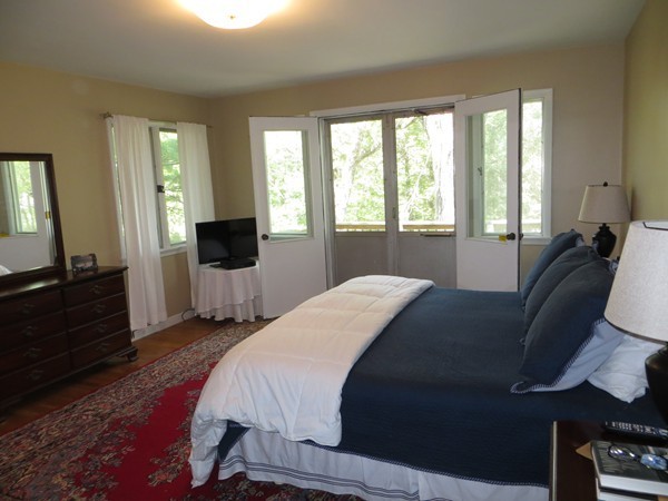 33 Woodfall Road Belmont, MA 02478 - Photo 11 of 22 a bedroom with a bed and wooden floor