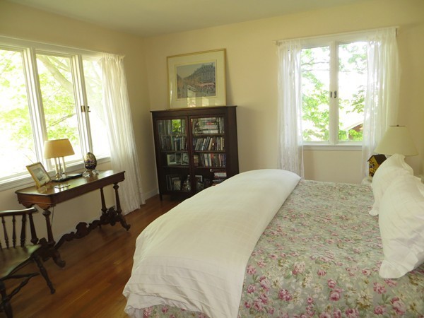 33 Woodfall Road Belmont, MA 02478 - Photo 12 of 22 a bedroom with a bed and wooden floor