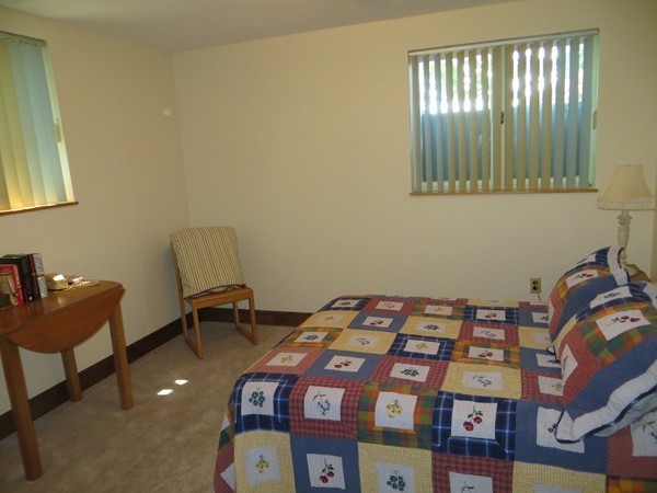 33 Woodfall Road Belmont, MA 02478 - Photo 13 of 22 a bedroom with a bed and a chair