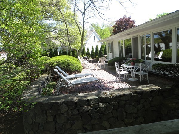33 Woodfall Road Belmont, MA 02478 - Photo 18 of 22 a view of a patio with table and chairs potted plants and large tree