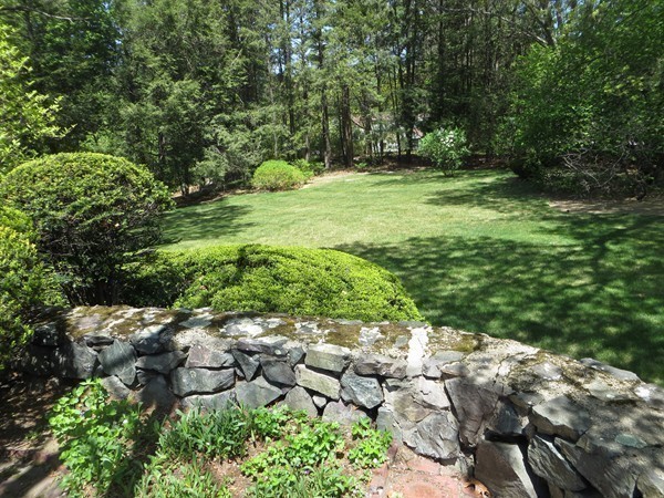 33 Woodfall Road Belmont, MA 02478 - Photo 19 of 22 a backyard of a house with a yard and outdoor seating