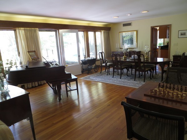 33 Woodfall Road Belmont, MA 02478 - Photo 5 of 22 a living room with furniture a large window and dining table
