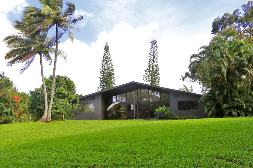 84 South Holokai Road Haiku, HI 96708 - Photo 1 of 17 a front view of a house with garden