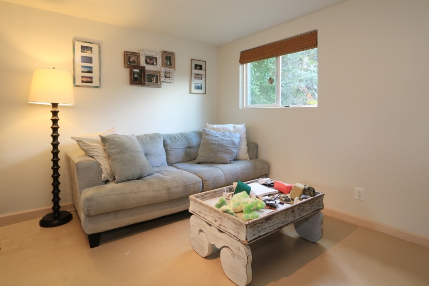 84 South Holokai Road Haiku, HI 96708 - Photo 12 of 17 a living room with furniture and a window