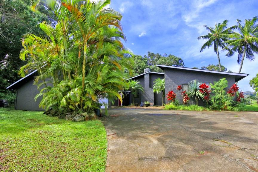 84 South Holokai Road Haiku, HI 96708 - Photo 17 of 17 a front view of a house with a yard and a garage