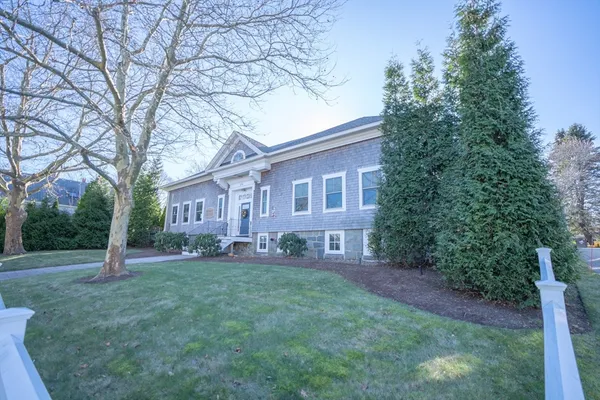 a house that has tree in front of a house