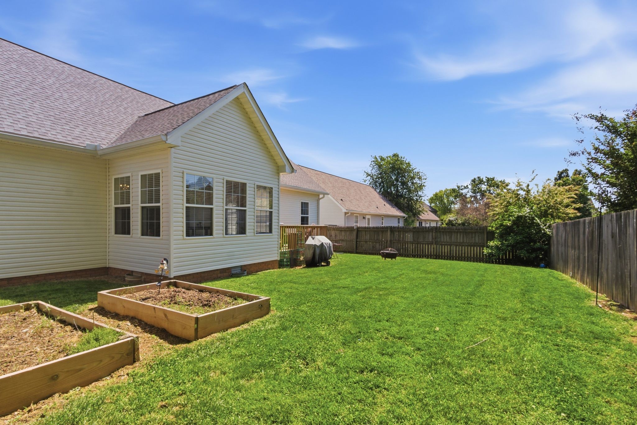 1503 Chapman Lane Spring Hill, TN 37174 - Photo 32 of 33 a view of a house with backyard and sitting area