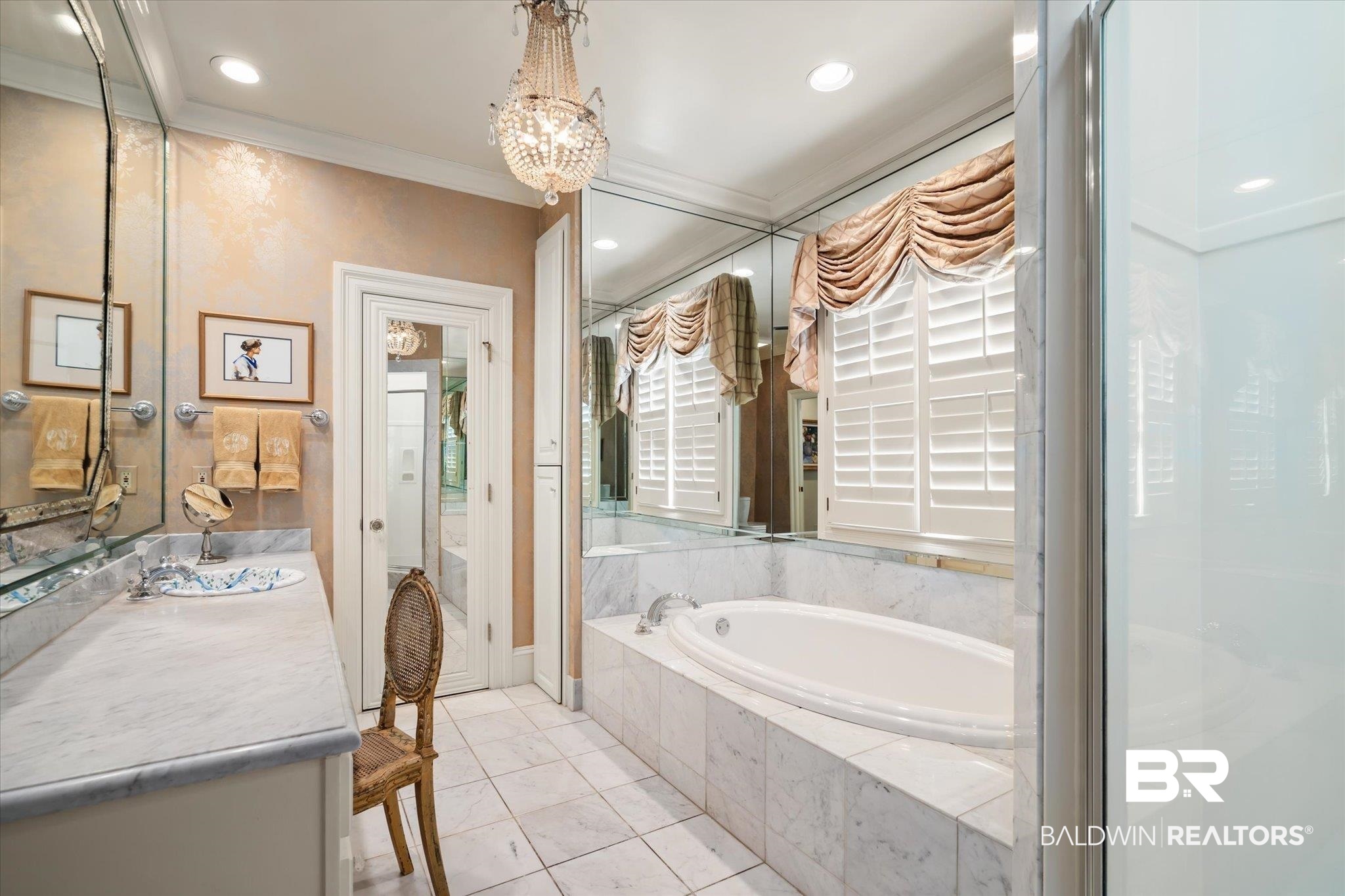 354 Dogwood Lane Mobile, AL 36608 - Photo 19 of 44 Bathroom with ornamental molding, vanity, a notable chandelier, tile patterned floors, and tiled bath