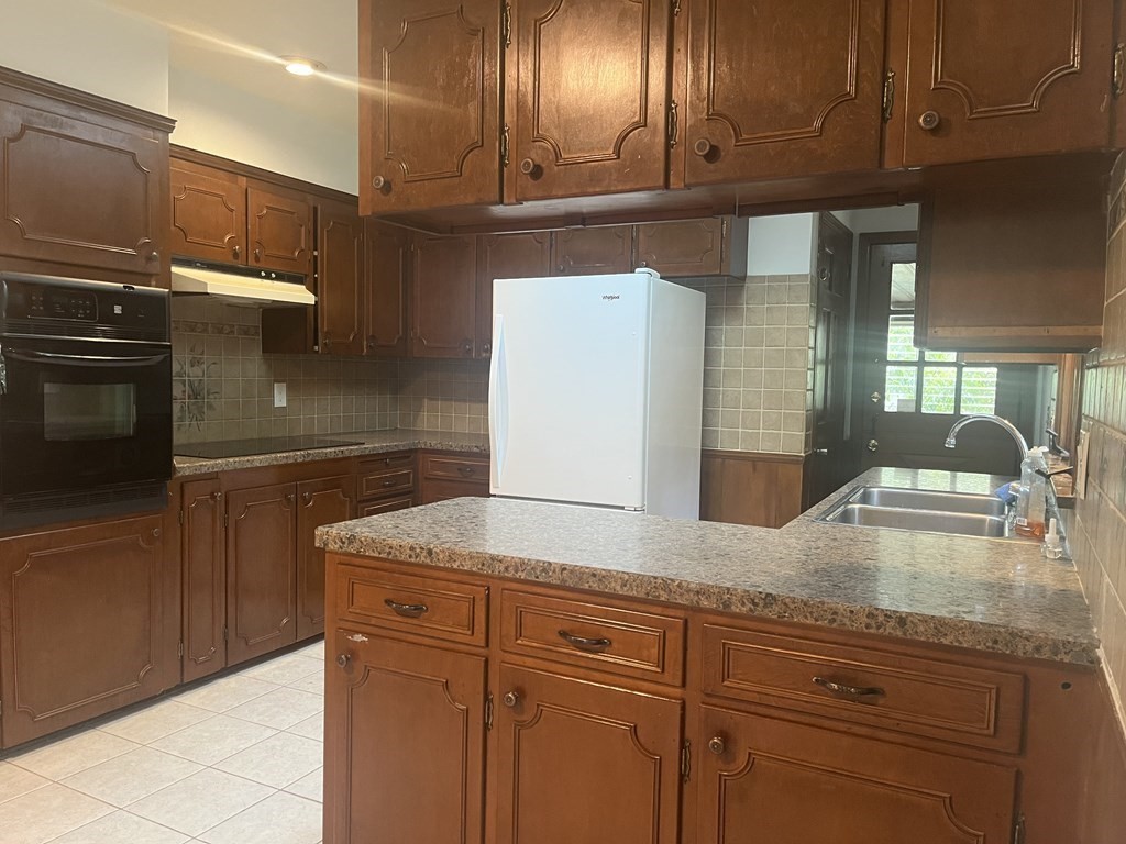 631 Allen Street Springfield, MA 01118 - Photo 3 of 15 a kitchen with cabinets and a sink