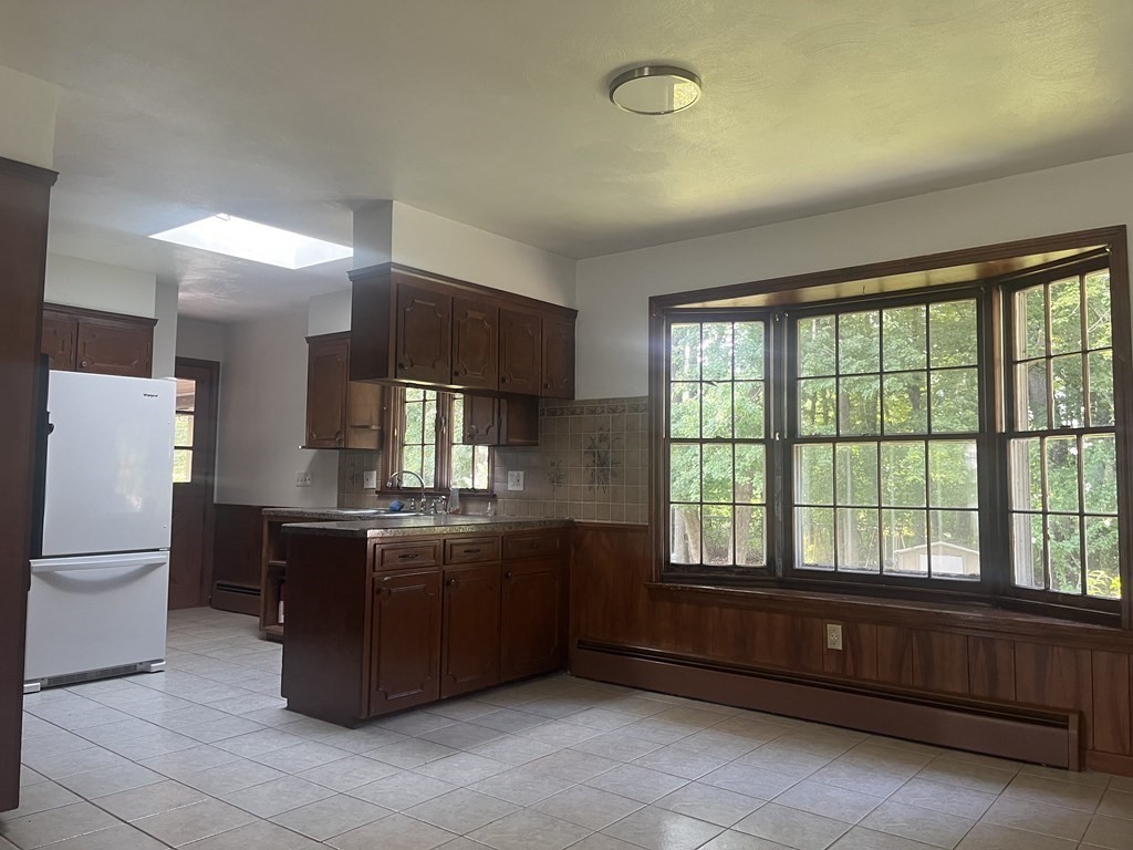 631 Allen Street Springfield, MA 01118 - Photo 4 of 15 a kitchen with a stove a refrigerator and dishwasher