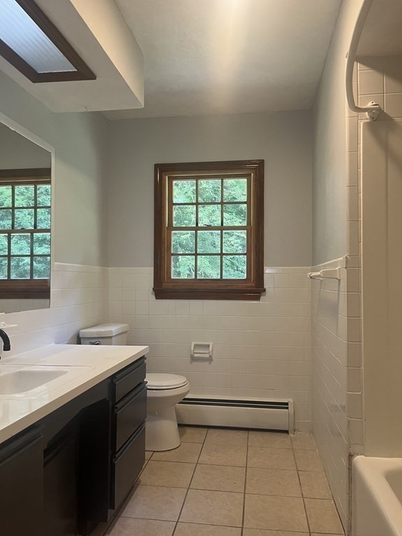 631 Allen Street Springfield, MA 01118 - Photo 7 of 15 a bathroom with a sink a toilet and a mirror