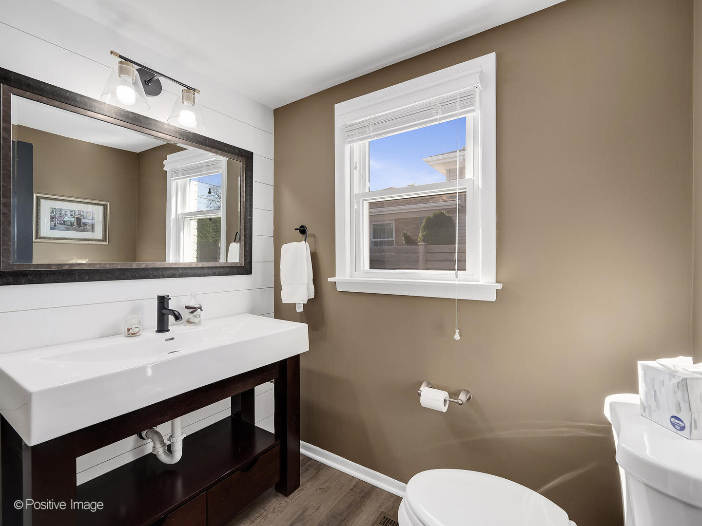 452 East Adams Street Elmhurst, IL 60126 - Photo 12 of 27 a bathroom with a sink mirror and a toilet