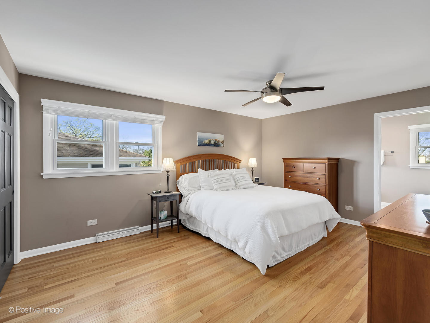 452 East Adams Street Elmhurst, IL 60126 - Photo 13 of 27 a bedroom with a bed and window