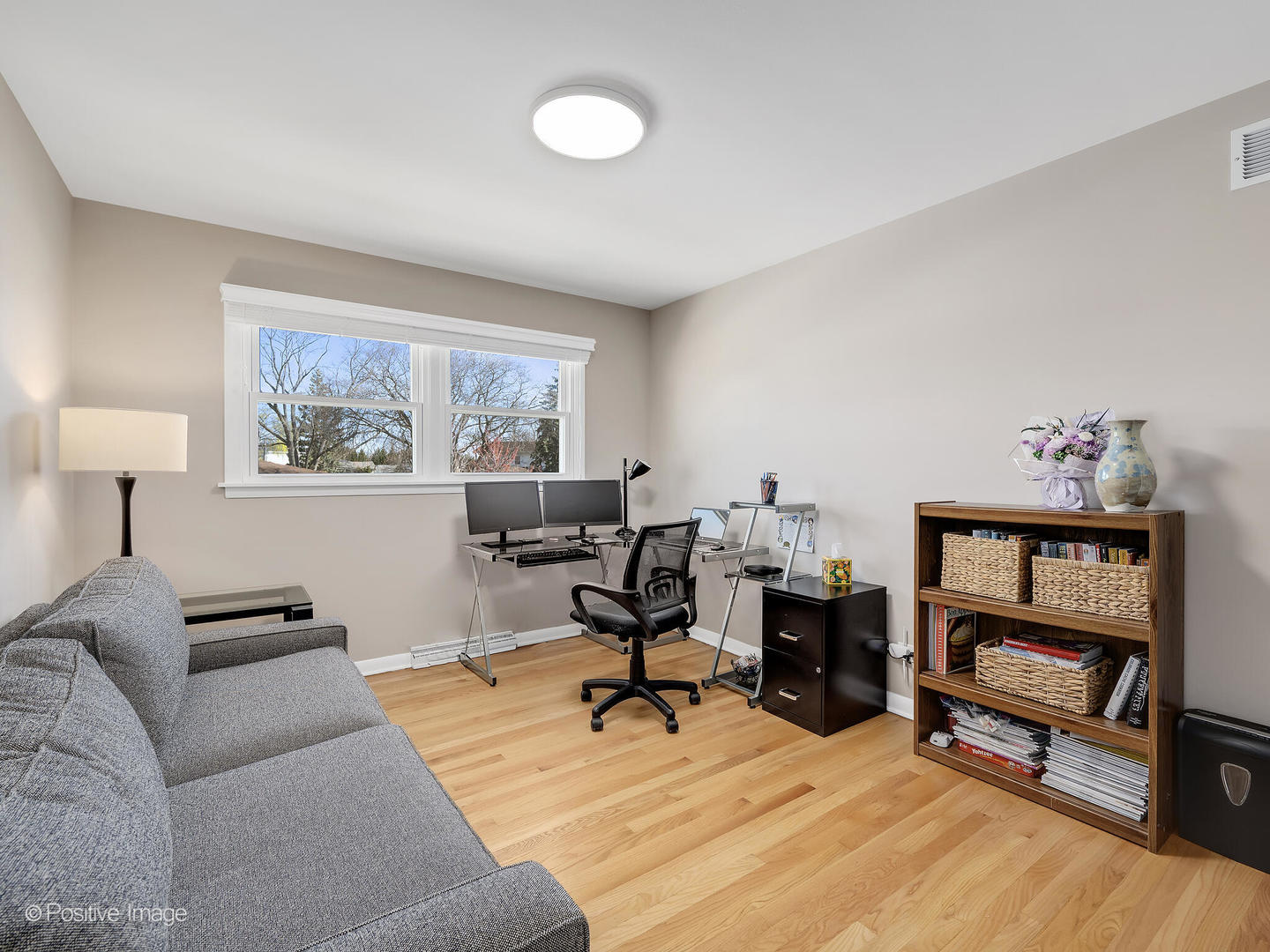 452 East Adams Street Elmhurst, IL 60126 - Photo 18 of 27 a view of a livingroom with workspace and a couch