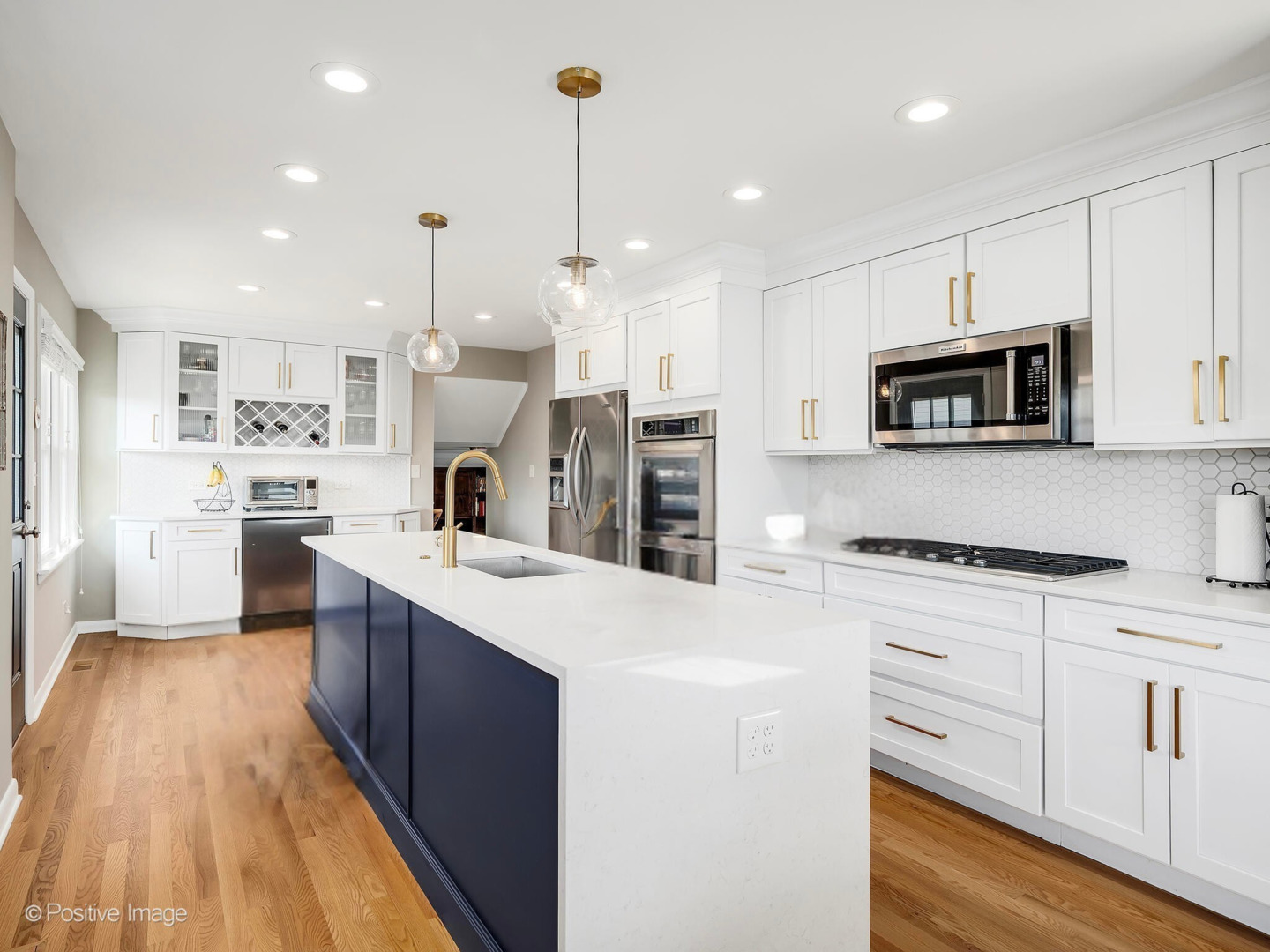 452 East Adams Street Elmhurst, IL 60126 - Photo 2 of 27 a kitchen with stainless steel appliances kitchen island granite countertop a stove a sink and a refrigerator