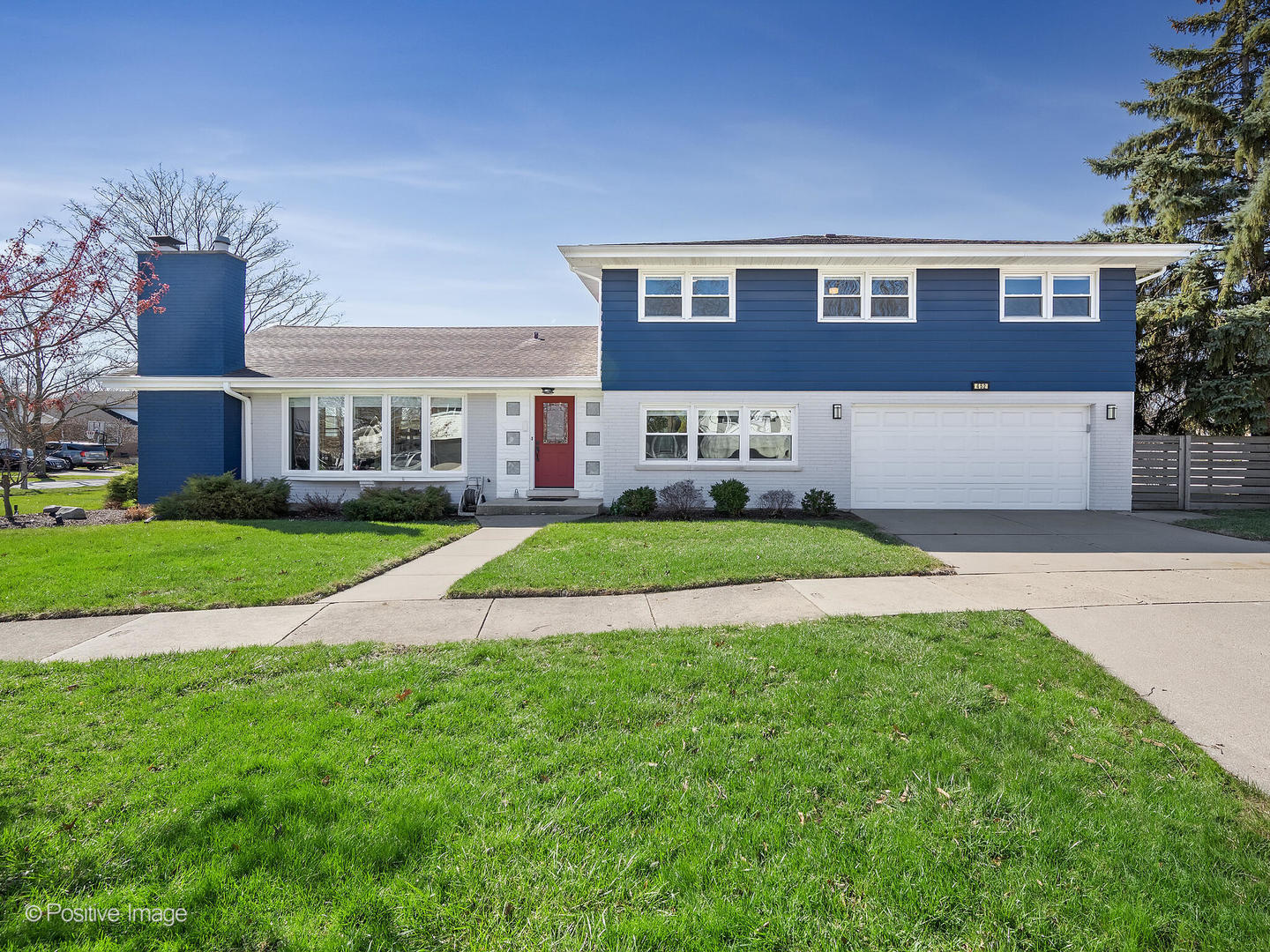 452 East Adams Street Elmhurst, IL 60126 - Photo 27 of 27 a front view of a house with a yard and green space