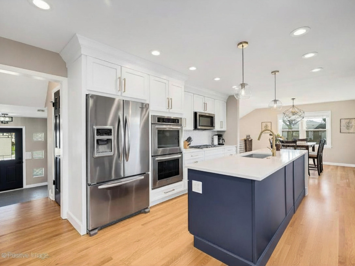 452 East Adams Street Elmhurst, IL 60126 - Photo 3 of 27 a kitchen with kitchen island a sink appliances and cabinets