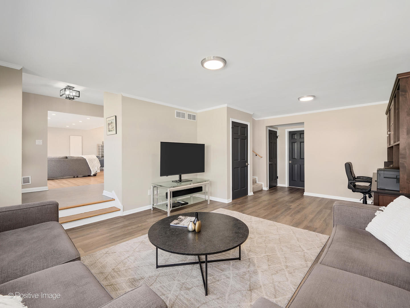 452 East Adams Street Elmhurst, IL 60126 - Photo 8 of 27 a living room with furniture and a flat screen tv