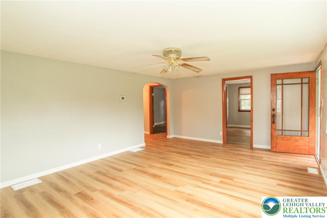 492 Filetown Road Nazareth, PA 18064 - Photo 12 of 30 Laminate flooring extends throughout this naturally illuminated living space, complemented by a ceiling fan.