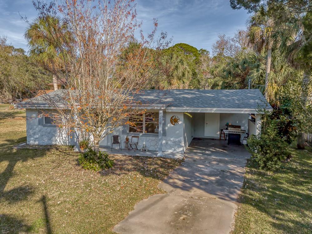 6434 Oelsner Street New Port Richey, FL 34652 - Photo 1 of 1 a view of a house with a yard and tree