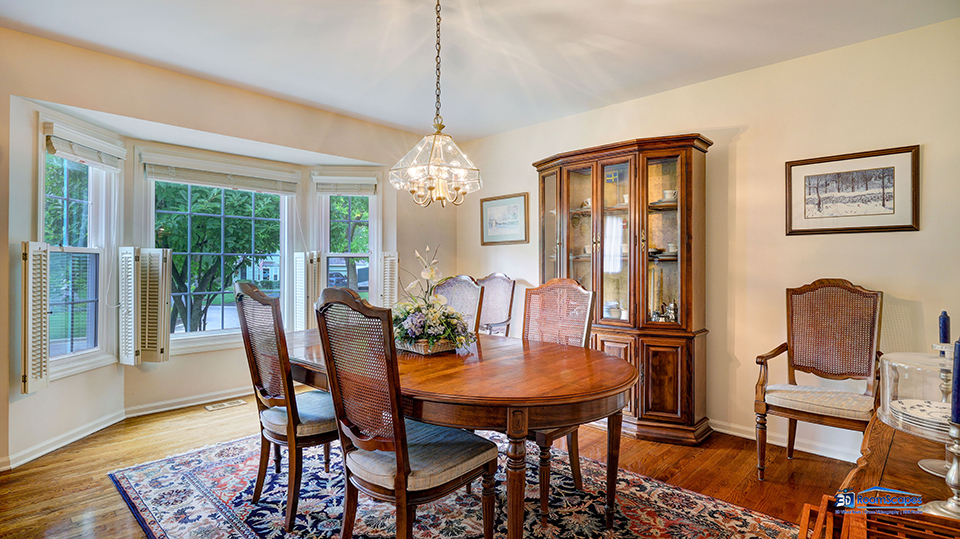 245 Pilgrims Path Gurnee, IL 60031 - Photo 15 of 54 a view of a dining room with furniture window and wooden floor