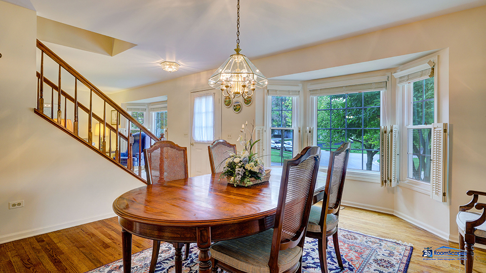 245 Pilgrims Path Gurnee, IL 60031 - Photo 16 of 54 a view of a dining room with furniture window and wooden floor