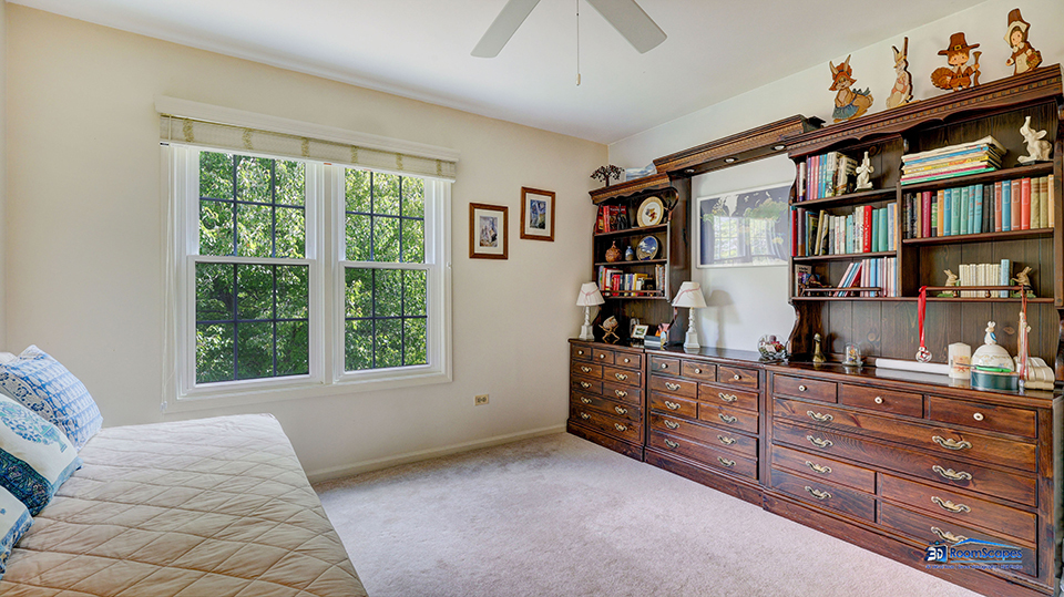 245 Pilgrims Path Gurnee, IL 60031 - Photo 26 of 54 a bedroom with a large bed and a window