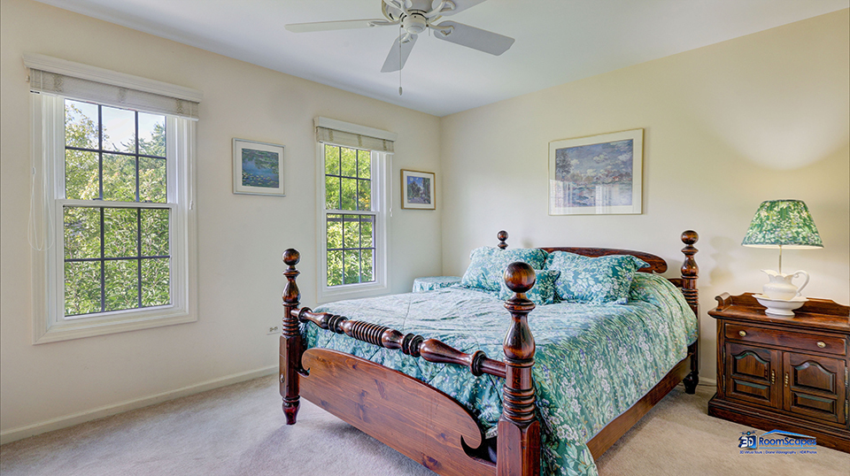 245 Pilgrims Path Gurnee, IL 60031 - Photo 29 of 54 a bedroom with a bed a dresser next to a window