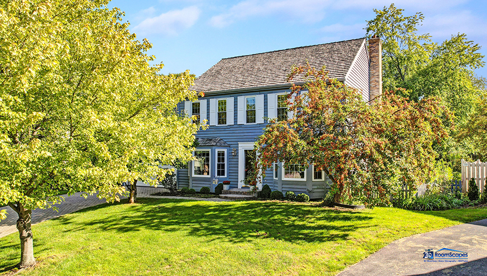 245 Pilgrims Path Gurnee, IL 60031 - Photo 32 of 54 a front view of a house with a garden