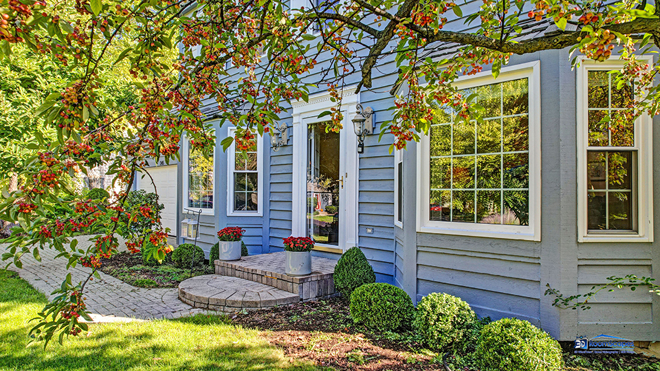 245 Pilgrims Path Gurnee, IL 60031 - Photo 34 of 54 a front view of a house with garden