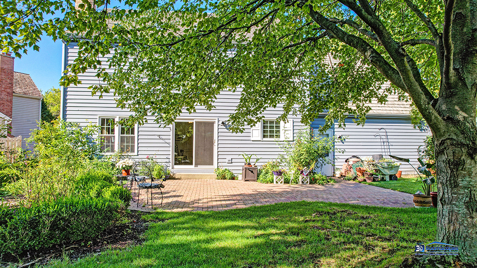 245 Pilgrims Path Gurnee, IL 60031 - Photo 40 of 54 a front view of a house with a yard and a garden