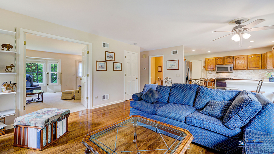 245 Pilgrims Path Gurnee, IL 60031 - Photo 7 of 54 a living room with furniture and wooden floor