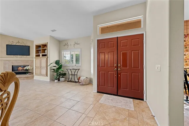 a kitchen with granite countertop a sink window and cabinets