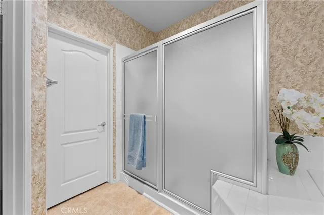 a view of room with wooden floor and ceiling fan