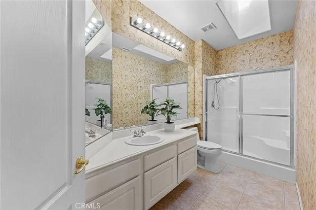 a view of living room with furniture and a chandelier