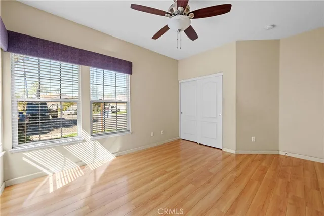 a room with furniture pool table and windows