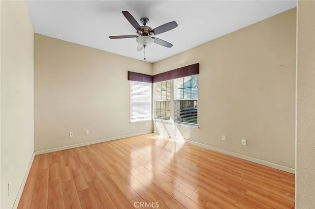 a room with lots of furniture and a flat screen tv