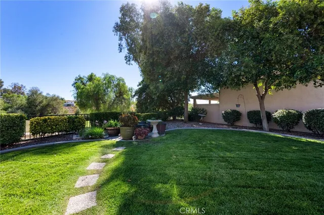 a view of a backyard with sitting area
